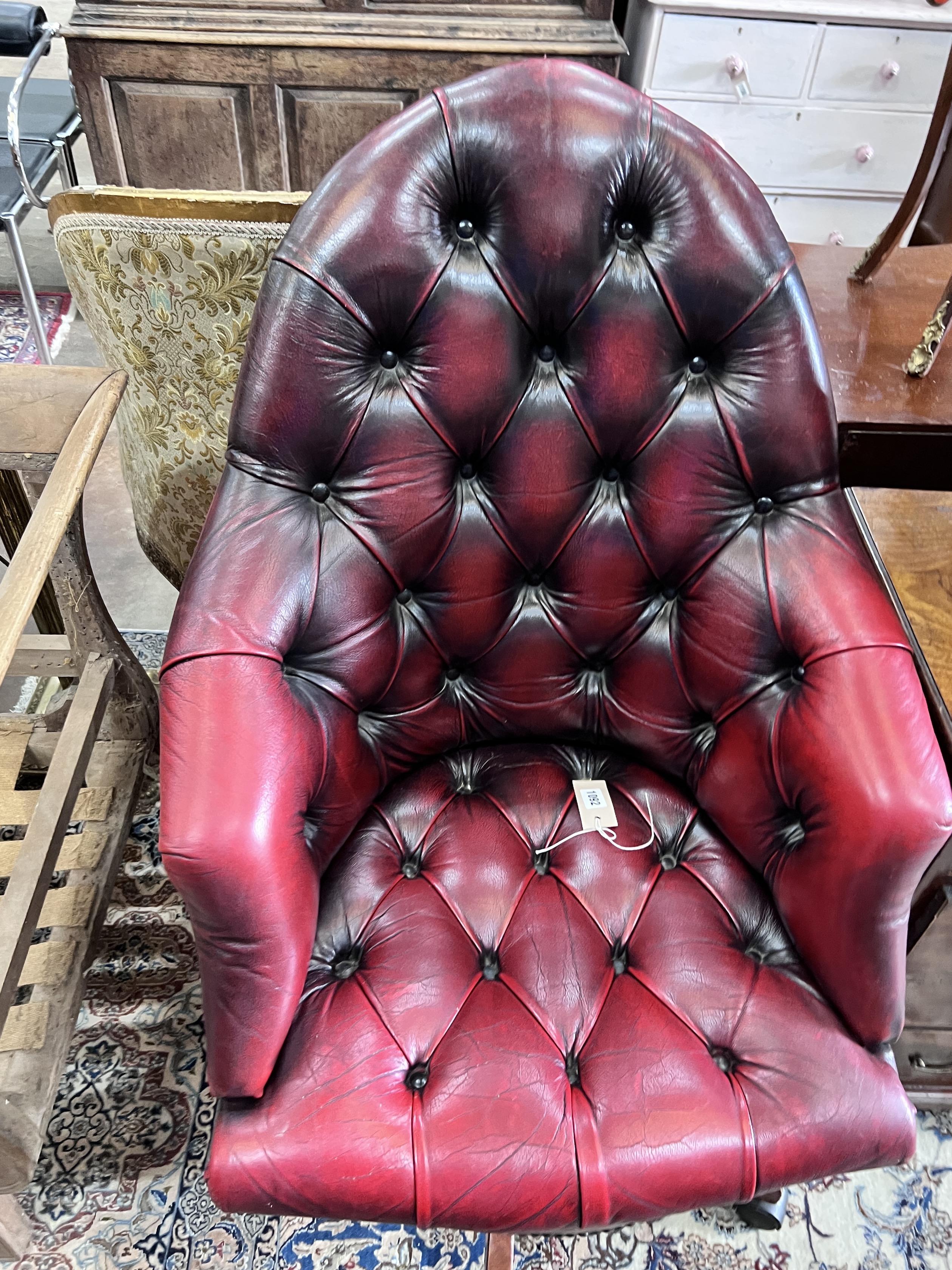 A Victorian style swivel desk chair, width 63cm, height 110cm